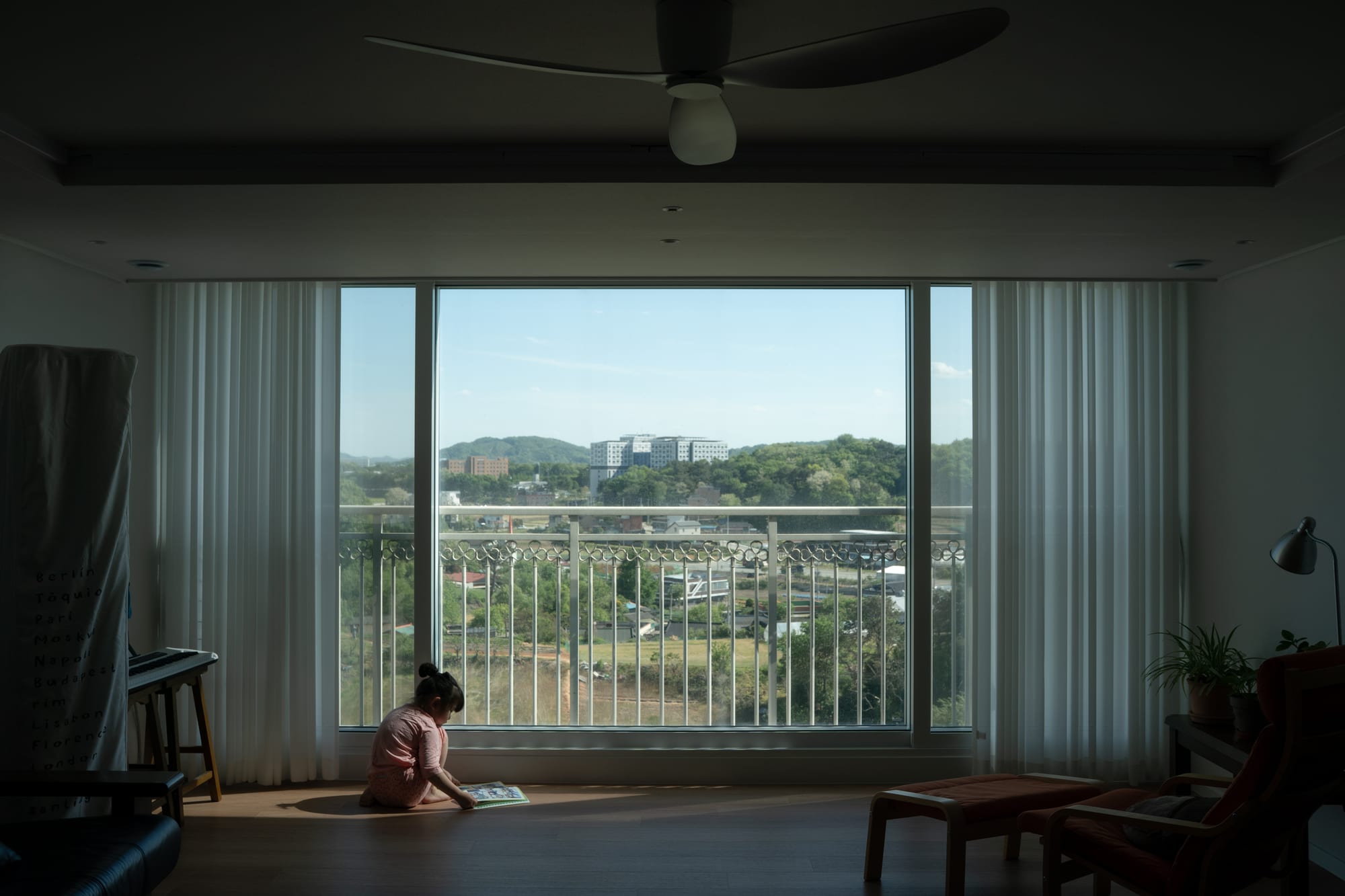 A child lies on the floor in the room.
